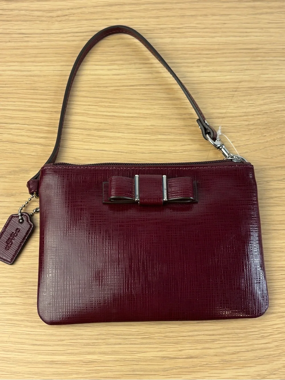 Coach Darcy Patent Leather Bow Small Wristlet in “Sherry” Wine Color NWT‎